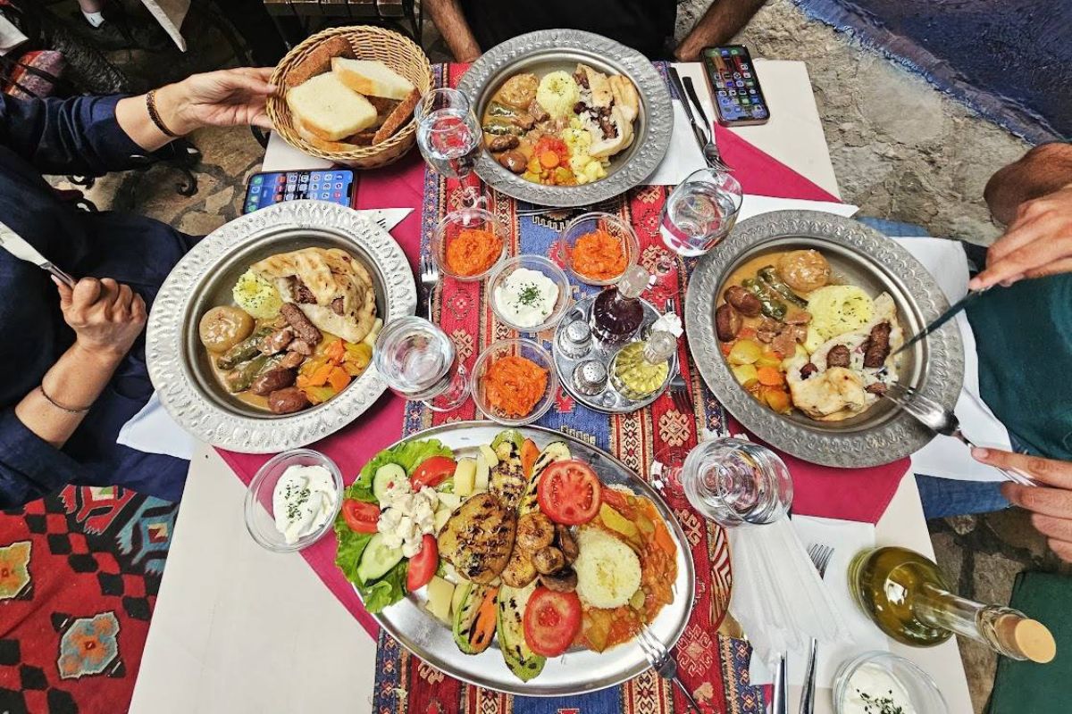 Table covered with various Balkan dishes