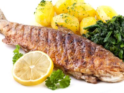 Whole grilled trout with potatoes and lemons