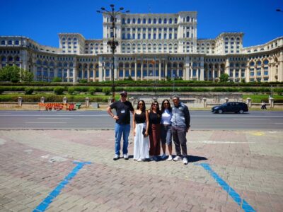 Tourists in front of the Parliament in Bucharest, Romania