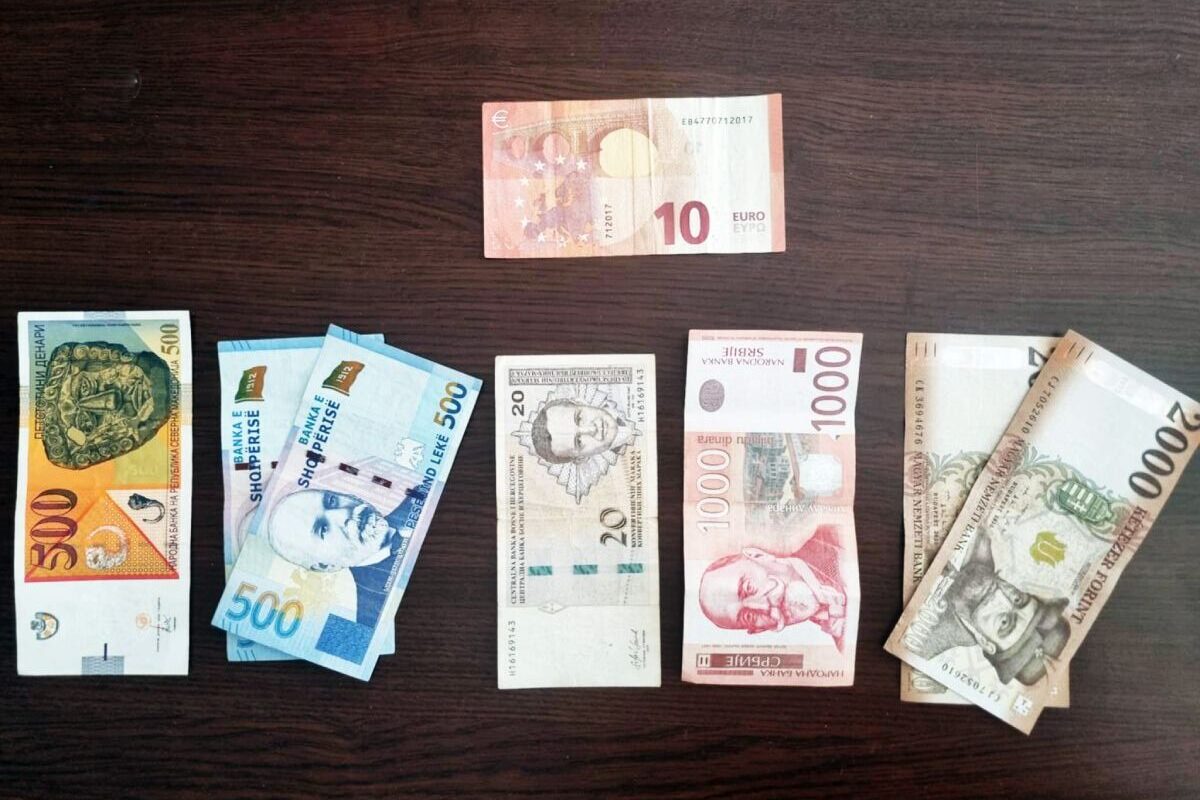 Banknotes representing the different currencies across the Balkan countries