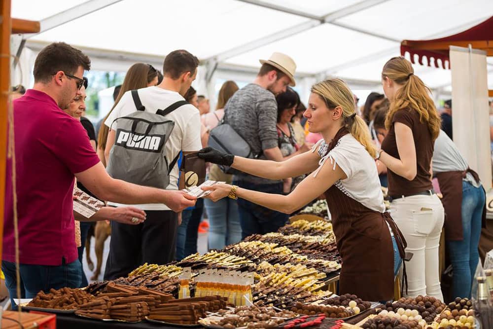 People tasting and buying chocolate at the Radovljica ChocolateFestival, Slovenia