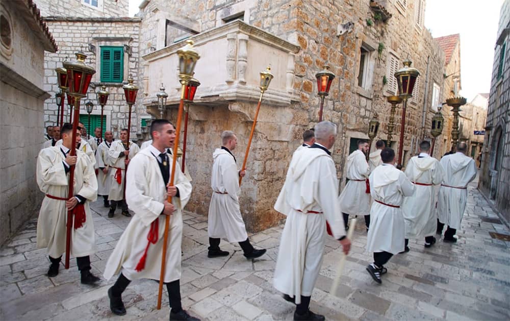 Catholic pilgrims leading torch-lit processions at “Za Križen”, Croatia