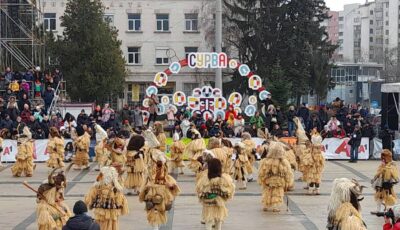 Kukeri dancing on the main stage at Surva Festival in Pernik, Bulgaria