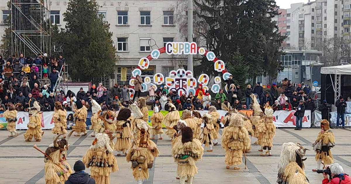 Kukeri dancing on the main stage at Surva Festival in Pernik, Bulgaria