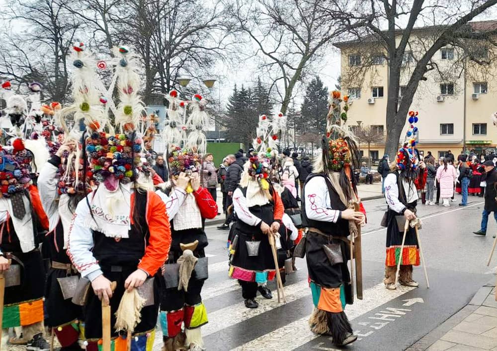 Colorful kukeri waiting at Surva Festival in Pernik, Bulgaria